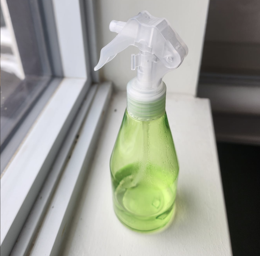 Spray bottle being sprayed